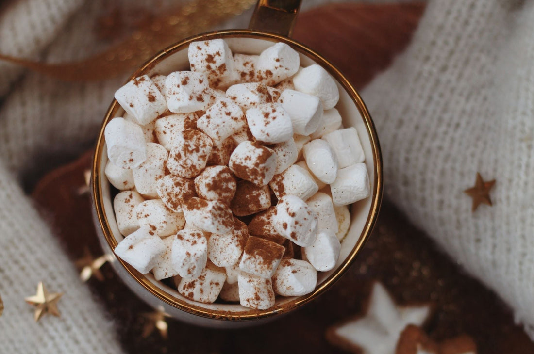 A cup of hot chocolate filled with mini marshmallows