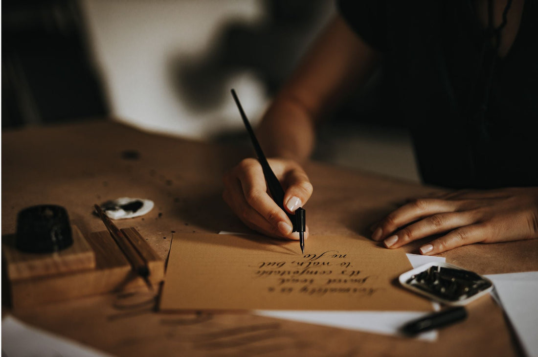 Calligraphy in progress on a cozy writing desk.
