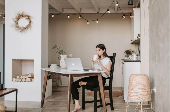 Woman sitting at desk and working from home