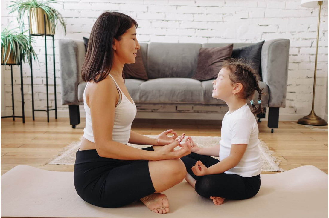 Woman and child meditating
