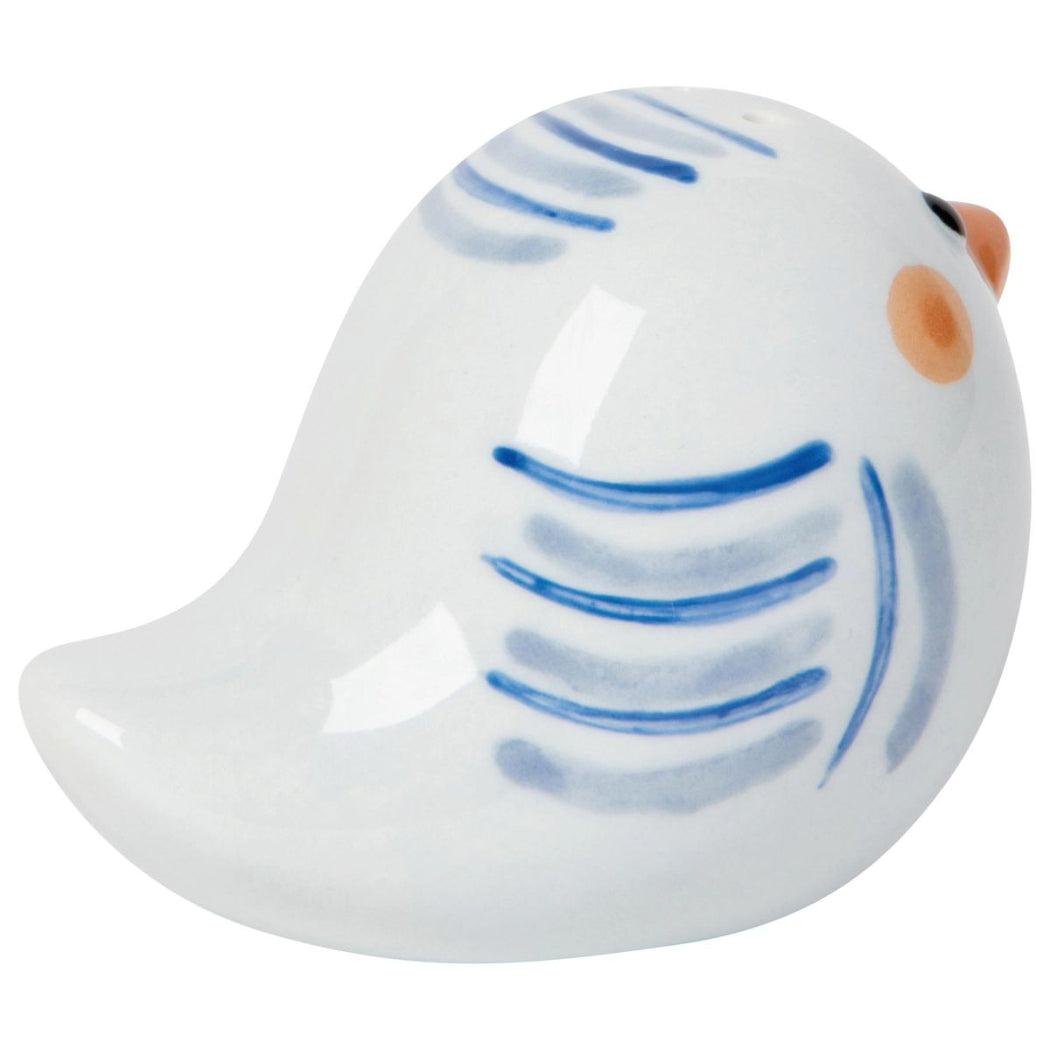 White ceramic bird figurine with blue patterns on a white background