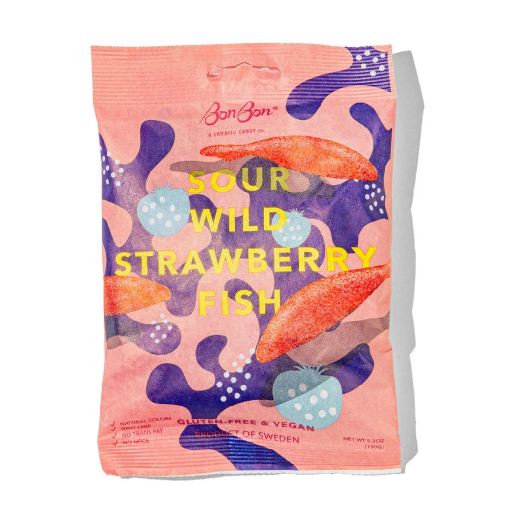 Bon Bon brand Sour Wild Strawberry Fish snack bag, featuring a pink background with purple abstract shapes, orange fish illustrations, and yellow text.