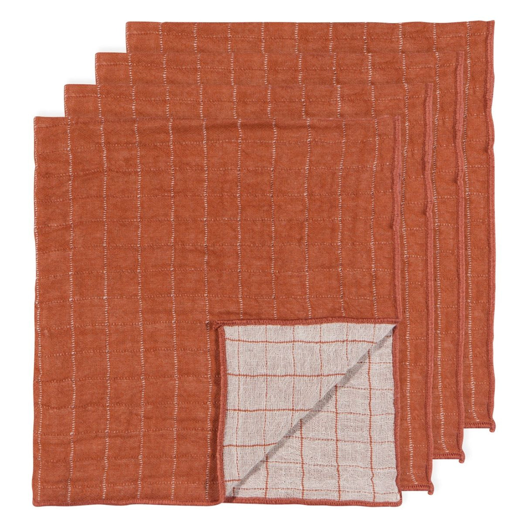 Cinnamon orange double-weave cotton napkins with thin white stripes, shown as a set with the natural unbleached reverse folded forward.