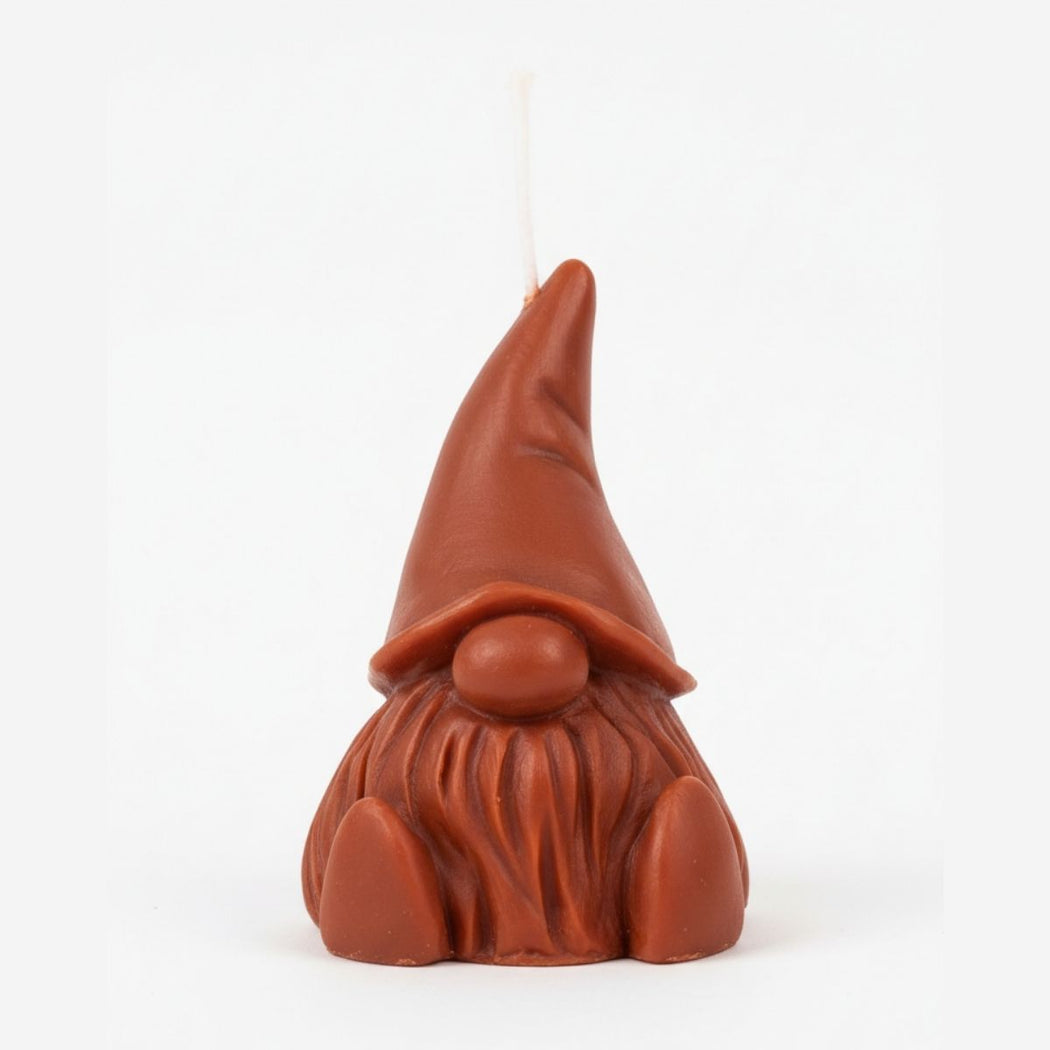 Brown gnome-shaped candle on a white background