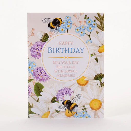 Birthday seed packet with bees and flowers on a white background