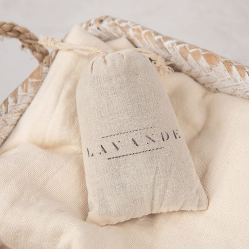 Lavender bag with 'LAVANDE' branding on a soft beige fabric background
