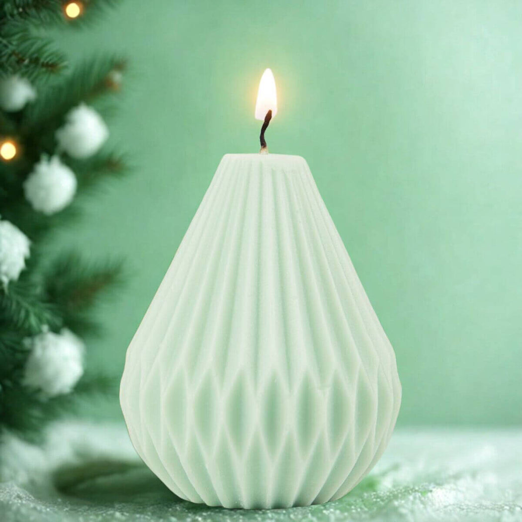 Mint Green Pear Shape Candle with a green background.