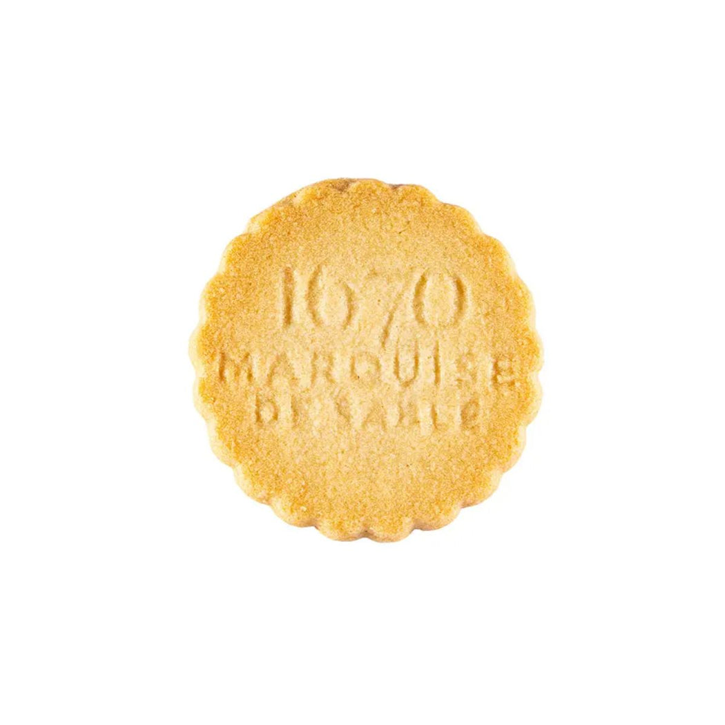 Round yellow cookie with '1670 Marquis de Sable' text on a white background