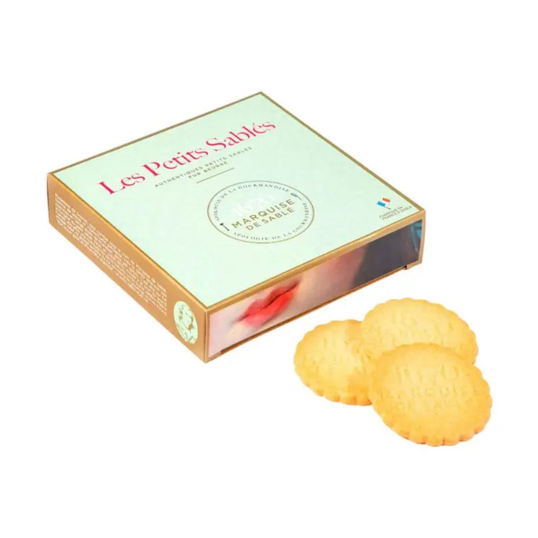 Box of 'Les Petits Sablés' pure butter cookies with two cookies in front on a white background