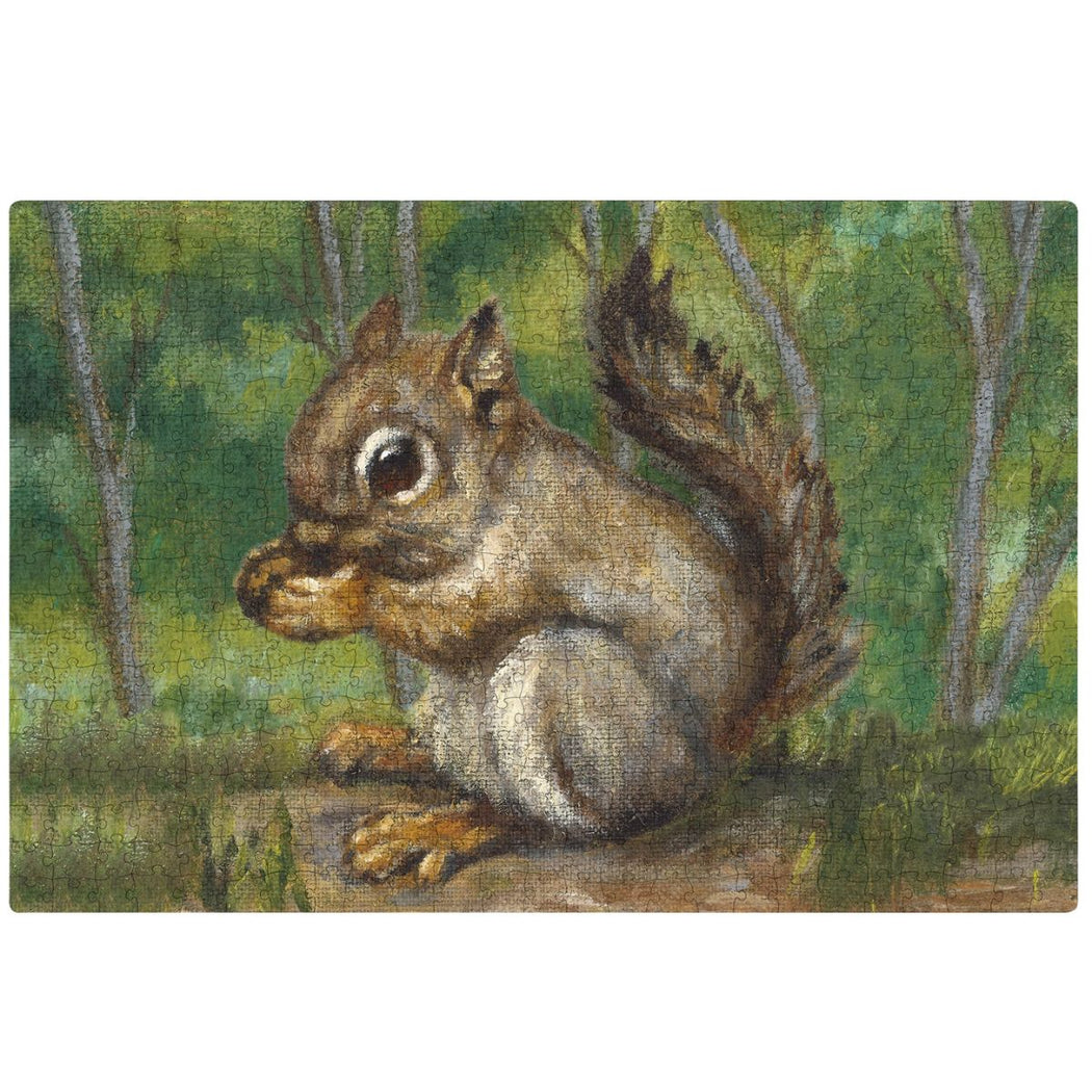 A rectangular 250 piece puzzle featuring a squirrel sitting on the ground in a green forest with an acorn between its hands.