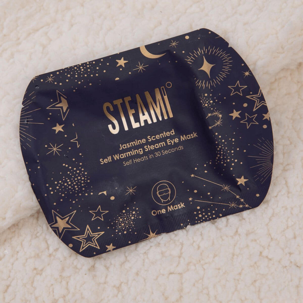 STEAMI self-warming steam eye mask packaging with star patterns on a textured white background