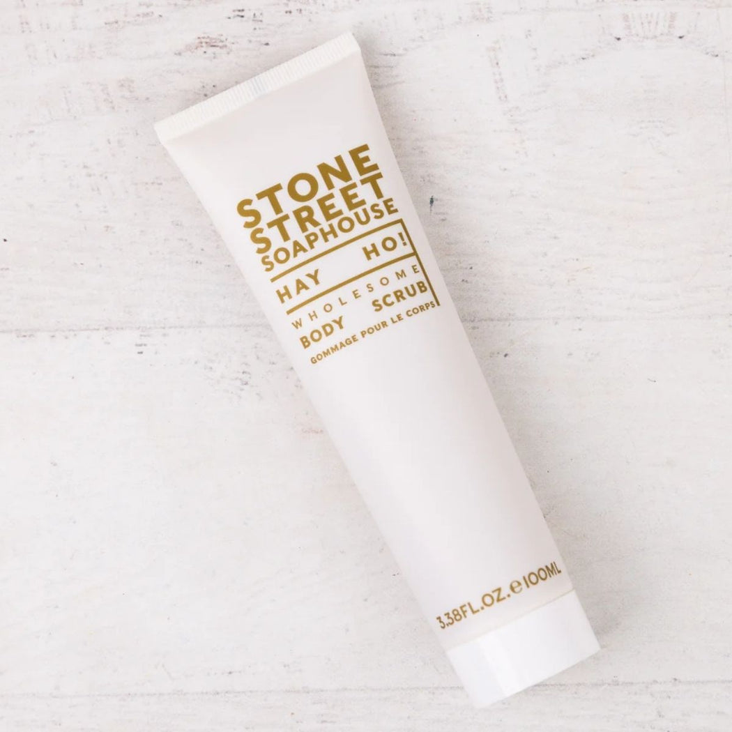 Chamomile & Walnut Body Scrub in a 100ml tube, labeled "Hay Ho!" and displayed on a neutral background with natural, cozy styling.