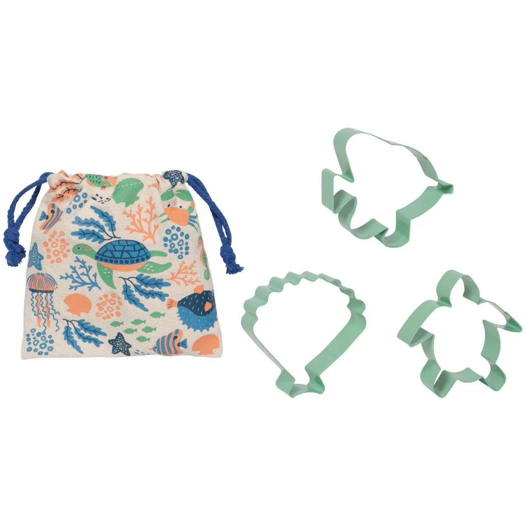 Set of sea-themed cookie cutters with a patterned drawstring bag on a white background