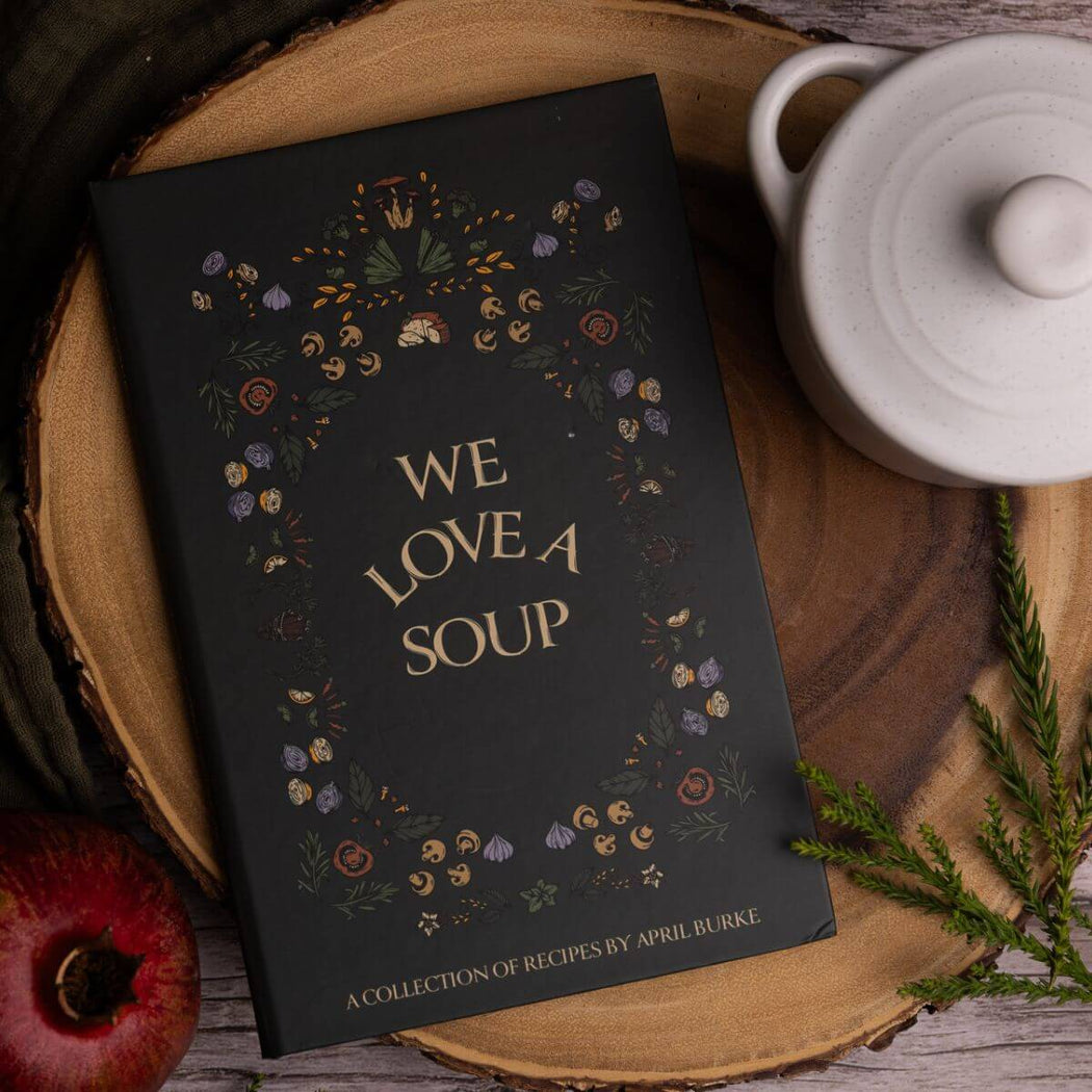 We love a soup cookbook on a piece of wood, with a mini round white cocotte.