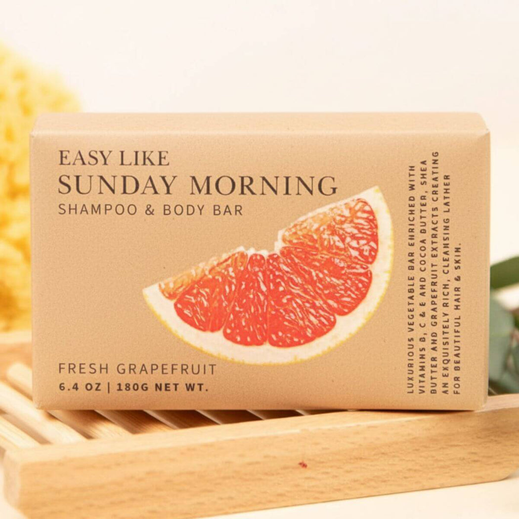 Shampoo and body bar with grapefruit slice design on a wooden block